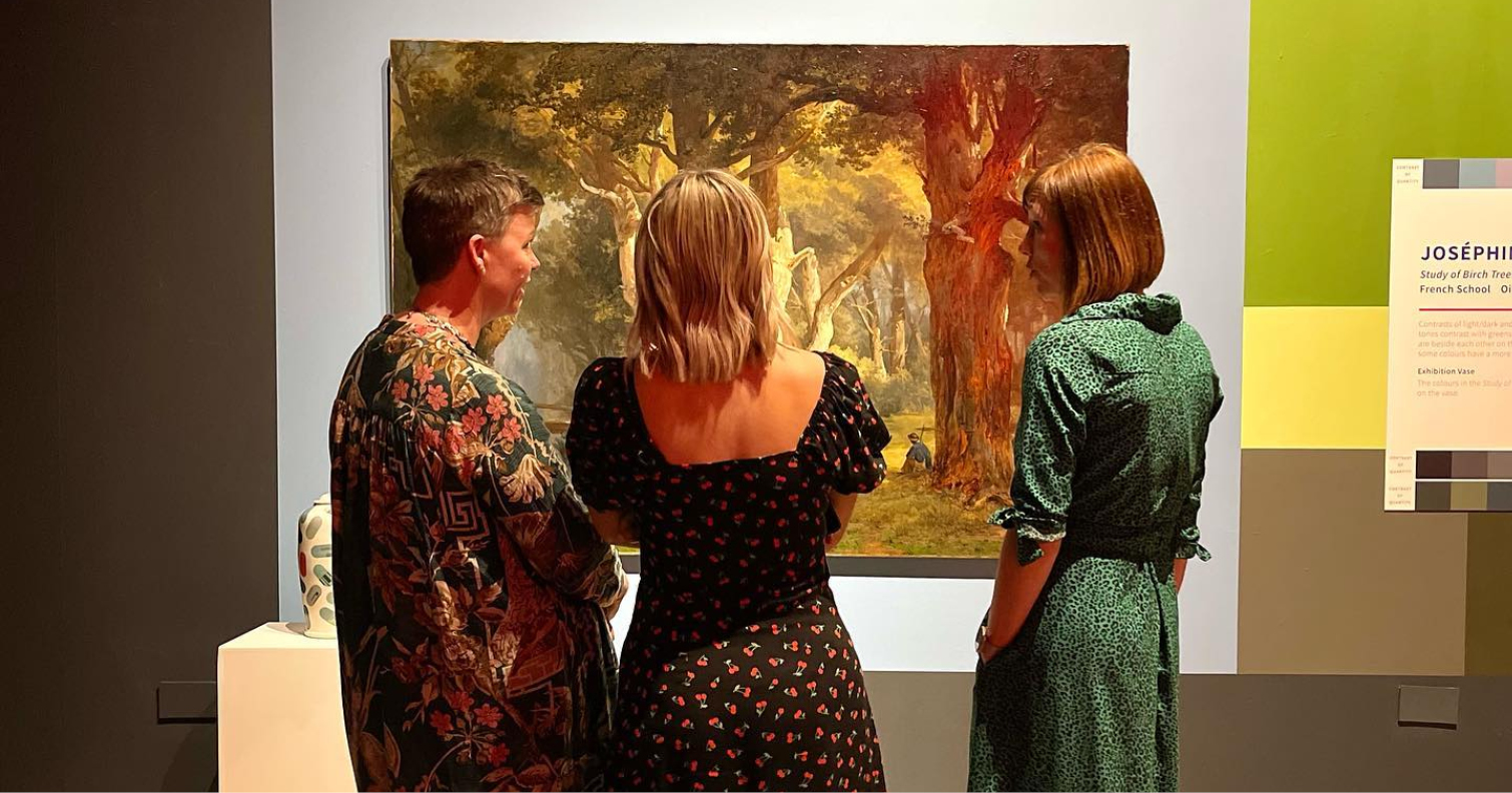 group of women looking at painting at Journey in Colour exhibition at The Bowes Museum